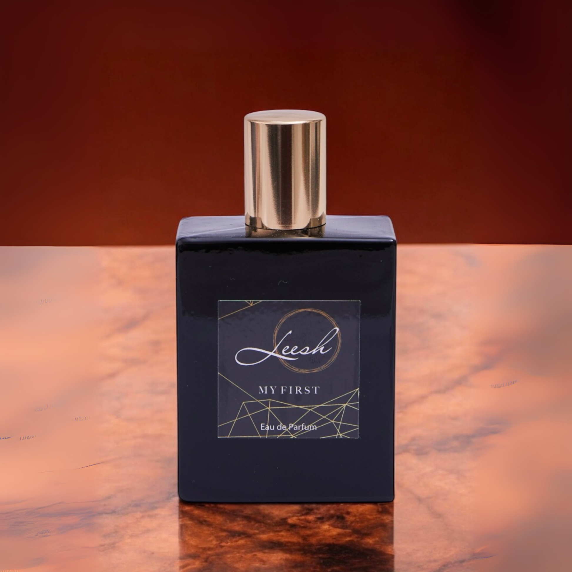 His My First by Leesh — a bold and confident fragrance for men. Featuring cedarwood, amber, bergamot, and black pepper, designed to celebrate life’s unforgettable firsts. Elegant bottle shot with warm amber lighting, reflecting sophistication and strength.