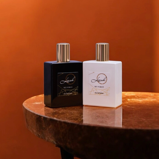 His and Her My First fragrances by Leesh — Her My First features patchouli, cedarwood, vanilla, jasmine, rose, ylang-ylang, amber, and musk. His My First features cedarwood, amber, bergamot, and black pepper. Celebrate unforgettable first moments with these bold, confident, and empowering scents.