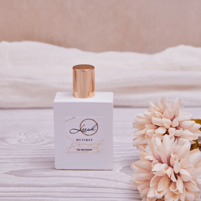 Her First luxury perfume featuring notes of patchouli, cedarwood, vanilla, jasmine, rose, and ylang-ylang — a premium fragrance celebrating confidence, femininity, and unforgettable first moments.