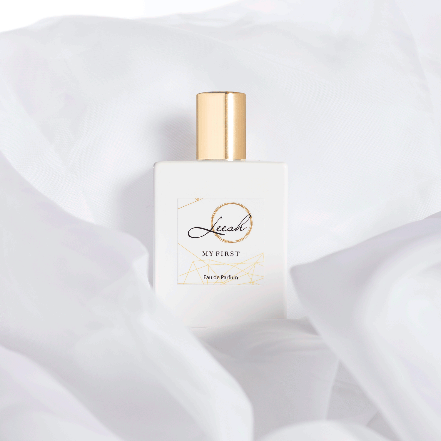 Her First perfume bottle with delicate details, a luxurious scent blending patchouli, jasmine, and vanilla for unforgettable memories.