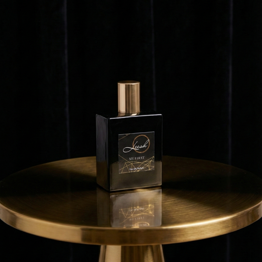 Perfume bottle on a gold table with a black background - His first perfume bottle by leesh fragrances presented in cinematic editorial style, luxury fragrance for day and special occasions