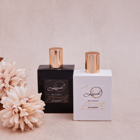 His & Her First luxury perfumes featuring notes of patchouli, cedarwood, vanilla, jasmine, rose, and amber — a premium fragrance collection celebrating unforgettable first moments